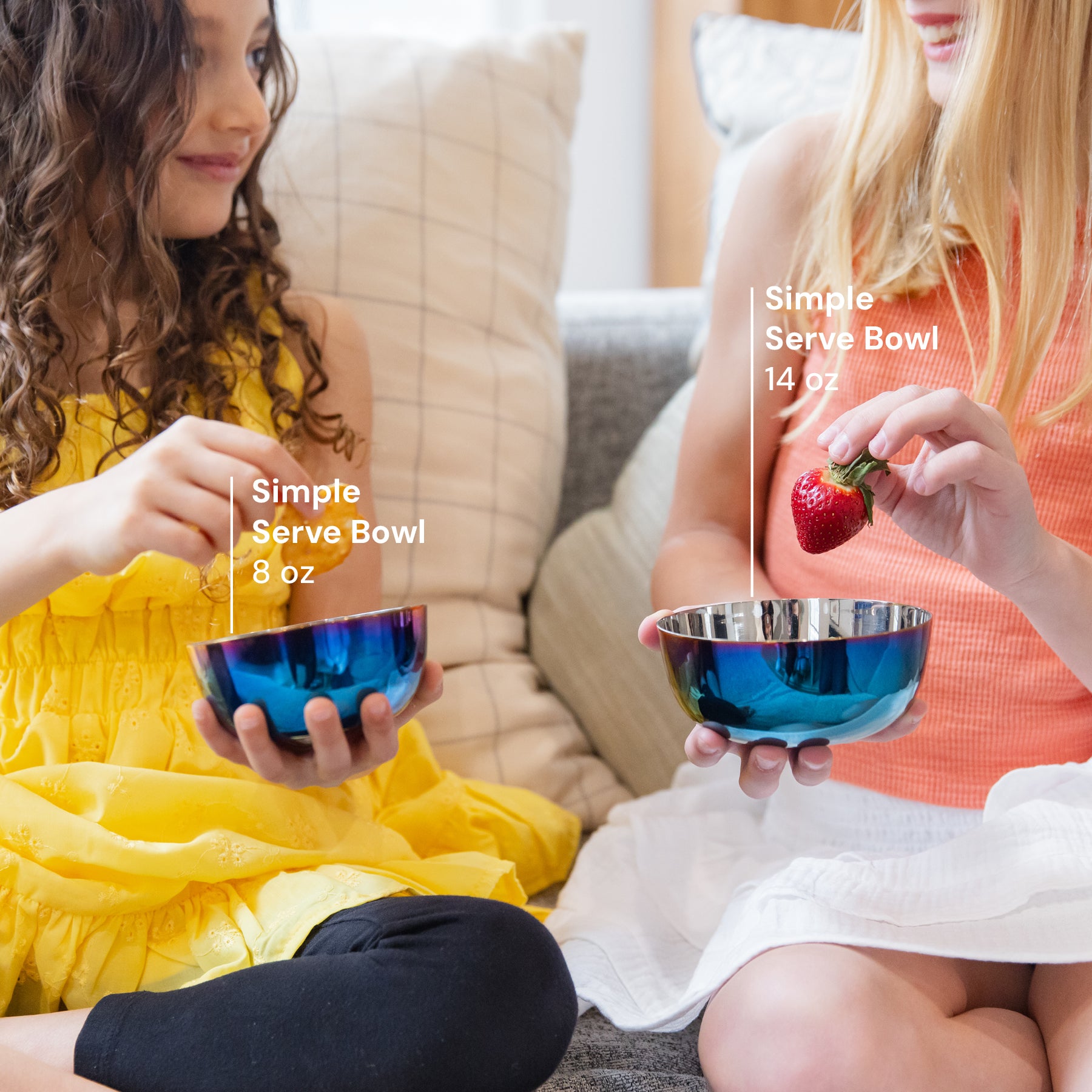 Two children eating fruit from 8 ounce stainless steel bowl and 14 ounce stainless steel bowl